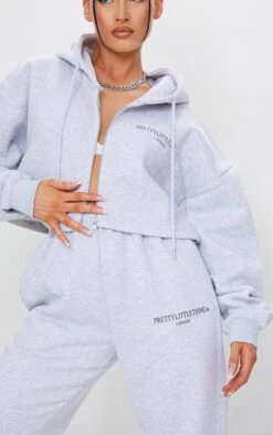 PRETTYLITTLETHING Grey Marl Copyright Graphic Zip Through Crop Hoodie Grey Marl -Prettylittlething 04374816d0599f0bdc3dc55e98b4238cd3b6faae cmq6908 4