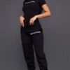 PRETTYLITTLETHING Black Logo High Waisted Cuffed Sweatpants Black
