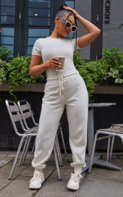 PRETTYLITTLETHING Off White Logo Short Sleeved Bodysuit Off White -Prettylittlething 225cafb5fca0759769090d953ca56e388b5079ee cmz3115 3