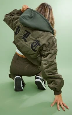 PRETTYLITTLETHING Khaki Graphic Back Jersey Hooded Bomber Jacket Khaki