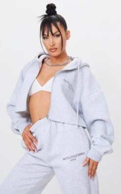 PRETTYLITTLETHING Grey Marl Copyright Graphic Zip Through Crop Hoodie Grey Marl -Prettylittlething 34dcf596501ccaaca025e221a570ecc958caa6c3 cmq6908 3