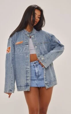 Prettylittlething Mid Blue Wash Racer Graphic Oversized Denim Jacket Mid Blue Wash