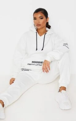 PRETTYLITTLETHING Cream Oversized Graphic Printed Pocket Front Hoodie Cream -Prettylittlething 5e34899b57a5c76df0605ab8386df7b862baff9e CMT8568 4