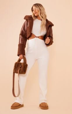 Prettylittlething Cream Long Sleeve Cut Out Ring Knitted Jumpsuit Cream