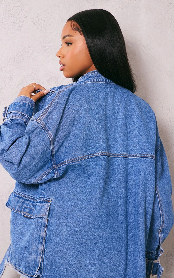 Prettylittlething Mid Blue Wash Buckle Detail Frayed Hem Denim Jacket Mid Blue Wash 2 Prettylittlething Mid Blue Wash Buckle Detail Frayed Hem Denim Jacket Mid Blue Wash - Image 2